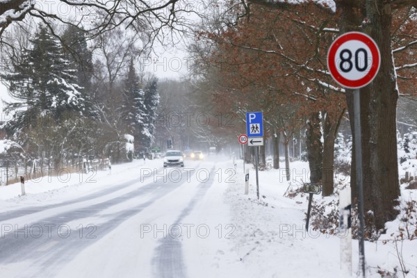Road traffic in winter, icy road covered with snow with car traffic, risk of accident,