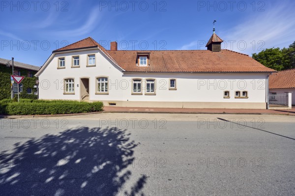 Historic residential building and commercial building, façade with windows, entrance, dormers,