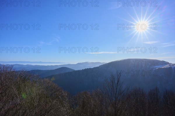 Bright sun over mountains with clear blue sky, winter view, morning, view, Rhine Valley,