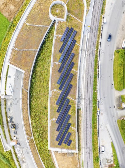 Flat roof with solar panels and surrounding infrastructure from a bird's eye view, new Park and