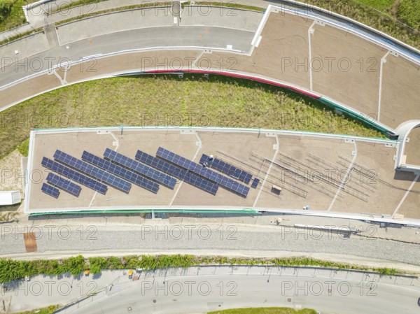 Top view of a roof area with installed solar system, aesthetically arranged, new park and ride