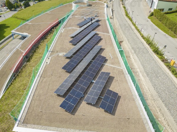 Solar panels on a green roof, surrounded by roads and buildings, new Park and Ride Calw Heumaden