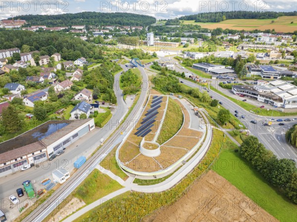 Wide view of an area with solar systems, surrounded by residential and commercial areas, new park