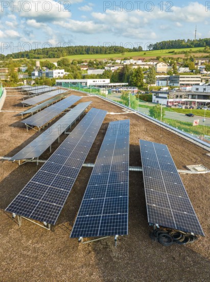 Rows of solar modules with views of the surrounding area and green hills, new Park and Ride Calw