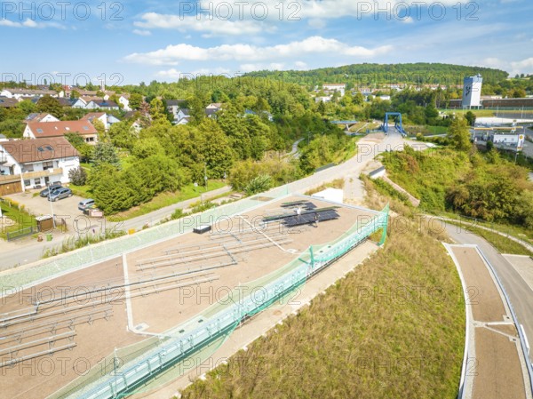 Overview of a village with a solar system in the neighborhood under blue skies, new Park and Ride
