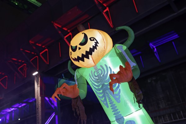 Illuminated scary figure at Halloween Run, night run in the Duisburg-Nord Landscape Park, Duisburg,