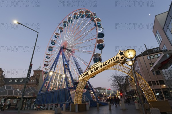 Duisburg Christmas market, illuminated entrance portal with Ferris wheel, twilight, Duisburg, North