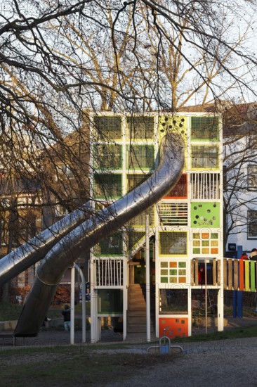 Children's playground with colorful climbing tower and slides, Immanuel-Kant-Park, Duisburg, North