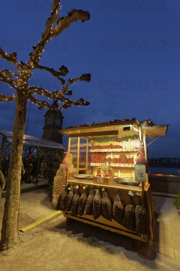 Illuminated chestnut stand at the Christmas market, roasted chestnuts, Düsseldorf Old Town,