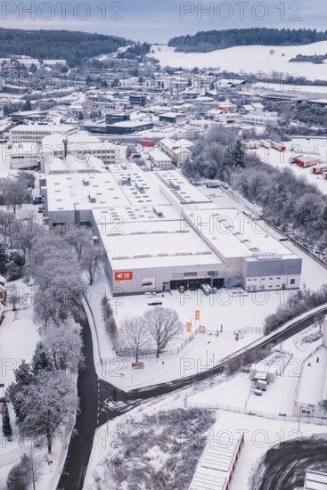 Snowy industrial view surrounded by trees and roads, in a winter landscape, Calw, Black Forest,