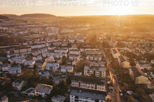 View of an urban landscape at sunset, with highly visible hills in the background, Calw, Black