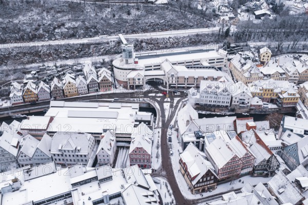 Aerial view of a snowy town with half-timbered houses and roads in winter, Calw, Black Forest,