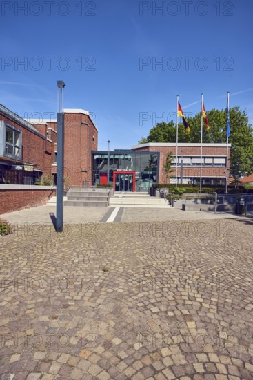 Town hall, brick building, modern architecture, entrance, staircase, lantern, flagpoles, flag,