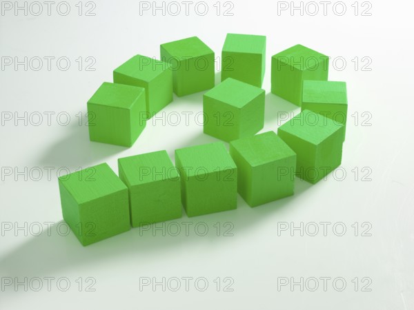 12 green wooden cubes against a white background
