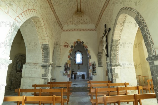 Painted church St Aignan's Church of Begues. Central nave flanked by two aisles. Allier department.