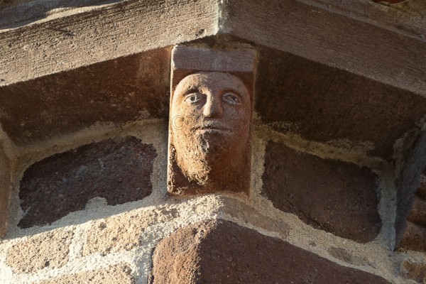 Azerat village. Sculpture of Roman church Saint-Jean-Baptiste . Haute Loire. Auvergne Rhone Alpes.