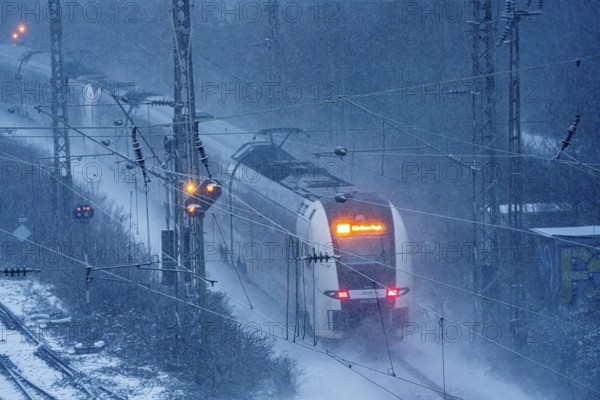Winter weather, snowfall, RRX, Rhine-Ruhr Express, regional traffic, on the route east, in front of