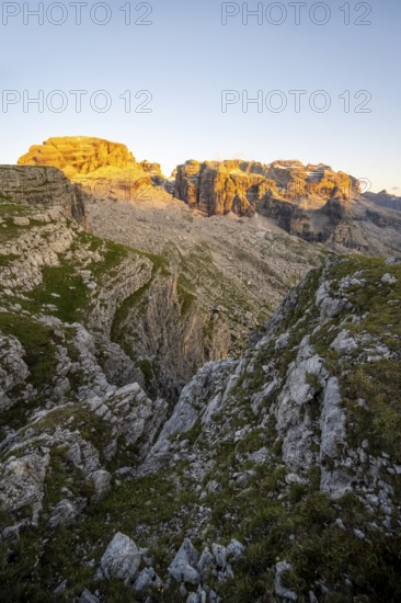 View of rocky mountain peaks of the Brenta Mountains at sunset, Alpenglühen, mountain landscape on