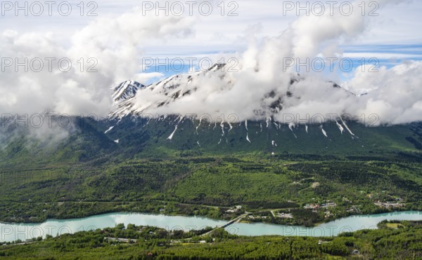 View of snowy mountains in spring and turquoise blue Kenai River, Slaughter Ridge Trail, Cooper