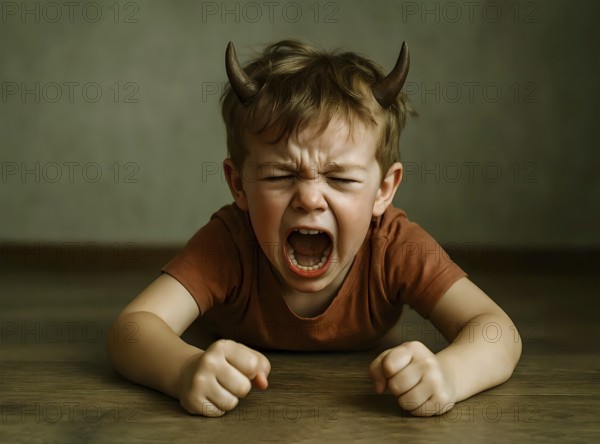 In little boy with devil horns screams and cries angry and angry, symbol anger, angry, upbringing,