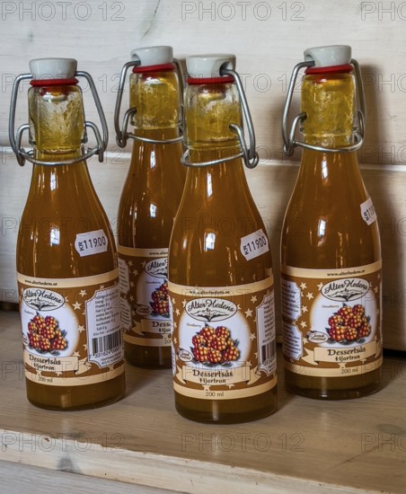 Swedish souvenir: cloudberry juice in a bottle in Smålandet Moose park in Markaryd, Småland County,