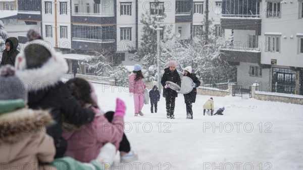 In Gaziantep, Turkey, on December 31, 2025, children and families enjoy winter activities as they