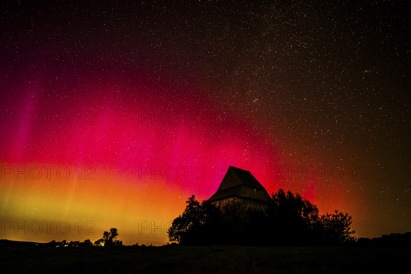 Colourful polar lights over the EXPO observatory in front of a starry night, EXPO Observatory,