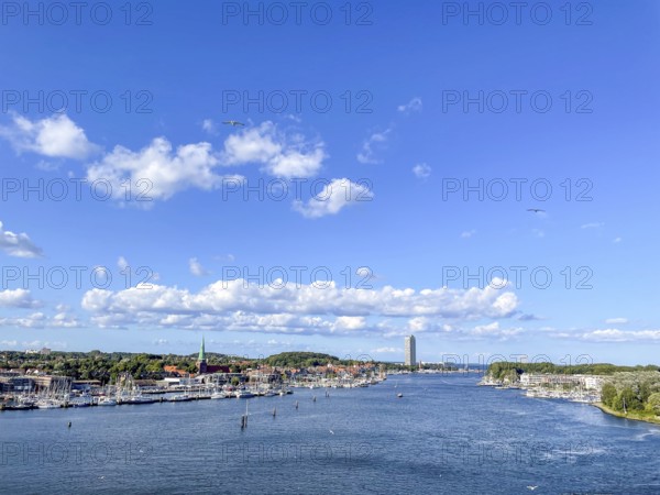 View over the Trave towards the mouth in the underground, the church of Travemünde and the Atlantic