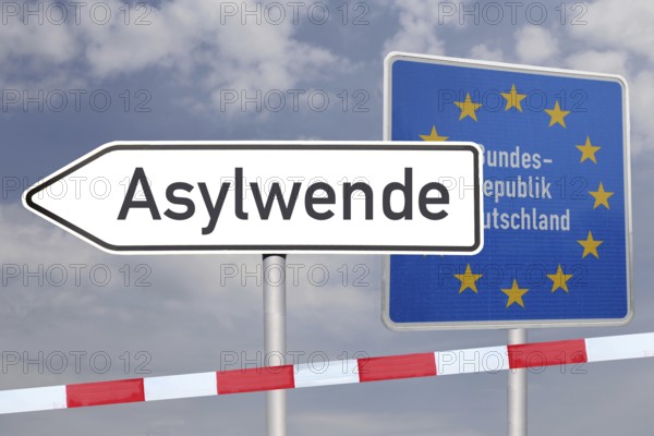 (Photo montage) Directional arrow with the inscription ASYLUM TURNDE in front of a border sign of