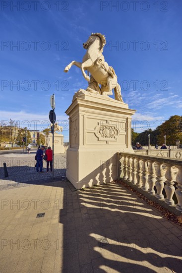 Castle bridge, entrance portal, horse sculpture, car bridge and footbridge, sidewalk, sandstone