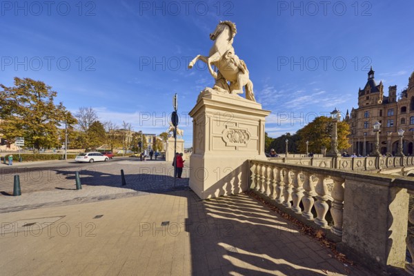 Castle bridge, entrance portal, horse sculpture, car bridge and footbridge, sidewalk, sandstone