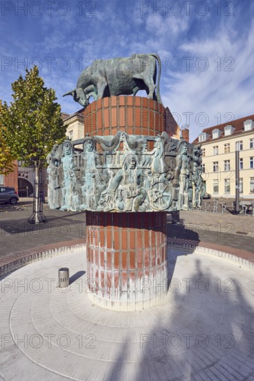 Pastor sin Kauh fountain, bronze sculpture, sculptor Stephan Horota, trees with autumn leaves,