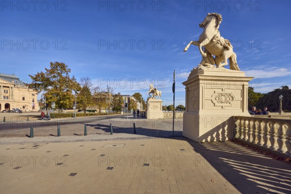 Castle bridge, entrance portal, horse sculpture, car bridge and footbridge, sidewalk, sandstone