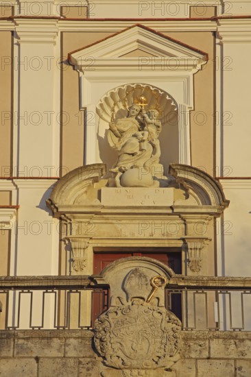 Portal with coat of arms and Madonna figure at the Benedictine monastery, Neresheim, Härtsfeld,