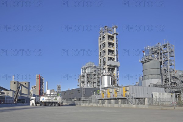 Schwenk cement factory industrial plant with silos and blast furnace, towers, truck, cement
