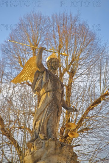 Justice as an angel and golden crown with cross, spear and beam scale, golden wings, symbol of