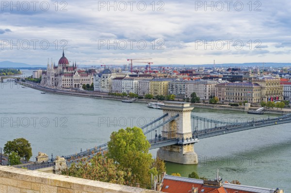Hungarian parliament along the Danube River and Chain Bridge, Budapest, Hungary