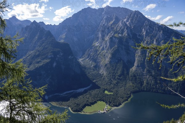 Deep view from Feuerpalfen of Lake Königssee with St. Bartholomä and some ships as well as the