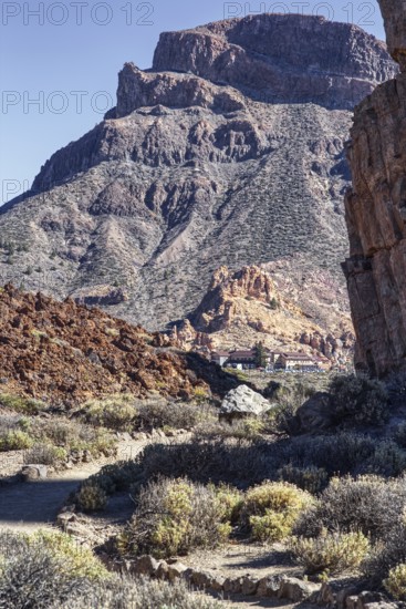 Steep mountain scenery with sparse vegetation in a dry landscape, Pico del Teide National Park, La
