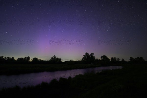 Aurora borealis aurora borealis on the Hunte dyke, Dümmerniederung nature park Park, Lower Saxony,