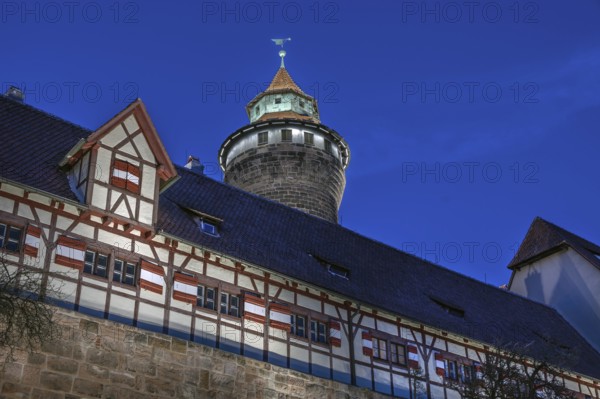 Sinwell Tower built in the 13th century, on the Nuremberg Kaiserburg in the evening lighting, blue
