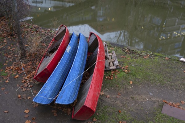 Assembled rowing boats on the banks of Pegnitz, river in Nuremberg, Middle Franconia, Bavaria,