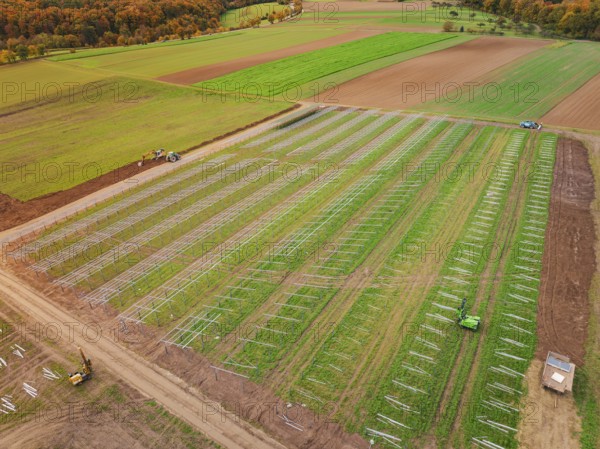 Large-scale field for the construction of a solar plant in autumn, energy revolution, construction