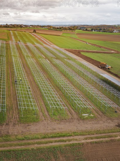 Start of a solar plant in fields with technical structures and a green environment, energy