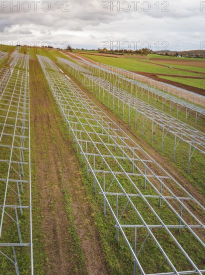 Structures of a solar plant during the construction phase on green fields, energy transition,