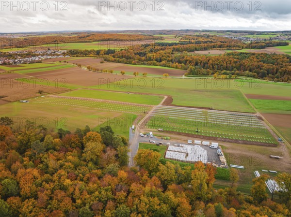 Autumn panorama with colorful foliage, fields and a small village in the distance, Energiewende,