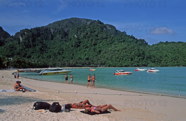 People, boats on the beach of Ko Phi Phi Don, two years in front of the tsunami, Thailand, December
