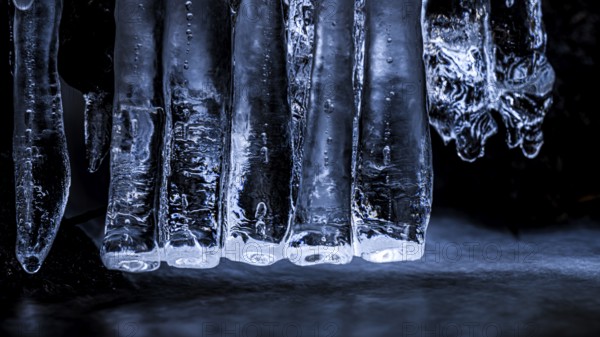 Close-up of blue icicles. Cool, frosty atmosphere reflecting the winter cold, Zwickenbach,