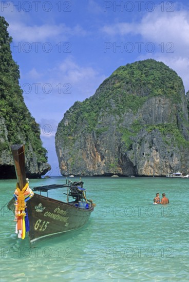 People, longtail boats on Maya Bay beach, known from the movie The Beach, one year in front of the