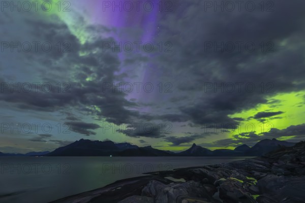The Vestfjord in Nordland, Norway, has an enchanting atmosphere at night. Dark clouds and vivid